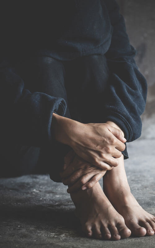 Depressed Person Sitting On Ground